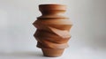 A clay vase with asymmetrical outs and unexpected protrusions challenging the idea of a traditional vessel.