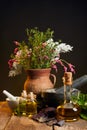 Vase with fresh herbs and flowers Royalty Free Stock Photo