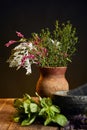 Vase with fresh wildflowers and herbs