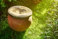 Clay water pot in the garden. Royalty Free Stock Photo