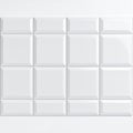 Clean arrangement of glossy white beveled tiles, creating a subtle grid pattern on white background Royalty Free Stock Photo