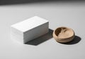 Minimalist composition featuring a white rectangular block and a small wooden bowl with dramatic shadows Royalty Free Stock Photo