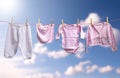 Clean baby girl clothes on the outdoor clothesline Royalty Free Stock Photo