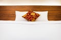 White bedding and pillow in hotel room, Clean Bedding sheets and pillow on natural wall