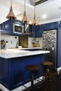 Clean blue kitchen with marble counter Royalty Free Stock Photo