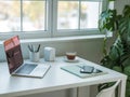 Modern home office desk setup with laptop and coffee Royalty Free Stock Photo
