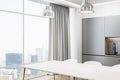 Clean bright and concrete kitchen interior with dining area, curtain, window and city view. Luxury designs concept. 3D Royalty Free Stock Photo