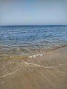 Clean clear beach sand in and calms sea wave , Muscat, Oman