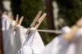 Clean clothes drying outdoors, closeup. Focus on clothespin Royalty Free Stock Photo