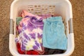 Clean Clothes folded in laundry basket Royalty Free Stock Photo