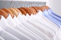 Clean clothes on hangers after dry-cleaning