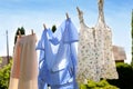 Clean clothes hanging on washing line in garden. Drying laundry Royalty Free Stock Photo