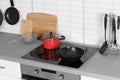 Clean cookware and utensils in kitchen