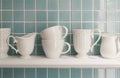 Clean cups on wooden shelf Royalty Free Stock Photo