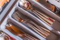 Clean cutlery is in the dishwasher. Knives, forks, spoons, teaspoons, dessert spoons, slicer. Close-up Royalty Free Stock Photo