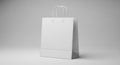 Blank White Paper Shopping Bag Mockup on Grey Background Royalty Free Stock Photo