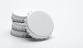 Stack of Blank White Bottle Caps with Single Cap Royalty Free Stock Photo