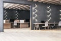 Clean dark loft coworking office interior with lamps. Workplace concept. Royalty Free Stock Photo