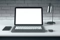Clean designer desk with laptop