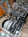 Clean dishes in dishwasher. Full load dishwashing machine Royalty Free Stock Photo