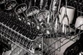 Clean dishes in the dishwasher. Wine glasses, sparkling wine glasses, white cups. Close-up. Washing-up and housework concept Royalty Free Stock Photo