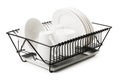 Clean dishes drying on metal dish rack Royalty Free Stock Photo