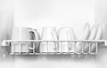 Clean dishes drying on metal dish rack Royalty Free Stock Photo