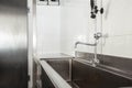 Clean dishwashing area in the kitchen of a hotel or restaurant Royalty Free Stock Photo