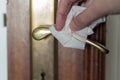 Clean and disinfect door handle. Germs, bacteria, Covid-19 Contamination Royalty Free Stock Photo