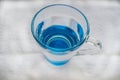 Clean drinking water with bubbles in a clear blue glass Royalty Free Stock Photo