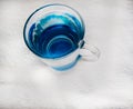 Clean drinking water with bubbles in a clear blue glass Royalty Free Stock Photo