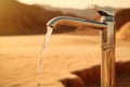 water flowing from a tap into the sand in the desert. Royalty Free Stock Photo