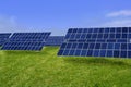 Clean electric energy solar plates in meadow Royalty Free Stock Photo