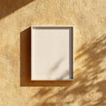 Blank Picture Frame Mockup on Textured Ochre Wall with Sunlight and Shadows Royalty Free Stock Photo