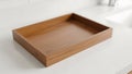 Simple Empty Wooden Tray on White Surface Royalty Free Stock Photo
