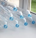 Clean empty used plastic water bottles on table - recycling and food storage Royalty Free Stock Photo