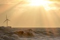 Clean energy production. Wind, wave and solar power in a beautiful seascape Royalty Free Stock Photo