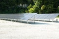 Clean Energy from Solar Panels by the Forest Royalty Free Stock Photo