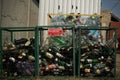 Clean environment concept. Glass and plastic bottles in different garbage containers. Trash sorting and waste recycling
