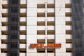 Clean facade of an abandoned hotel building with broken windows during the day, with simple lines Royalty Free Stock Photo