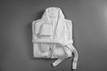 Clean folded bathrobe and slippers on background, top view Royalty Free Stock Photo