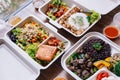 Clean food meal boxes: rice and rice berry with beef, salmon and chicken in various vegetables and salad for good health Royalty Free Stock Photo