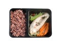 Clean food meal good for health and for diet. Brown rice with steamed fish and vegetable, carrot in black box Royalty Free Stock Photo