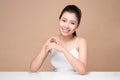Clean fresh skincare concept. Young asian woman touching enjoying hand skin. Royalty Free Stock Photo