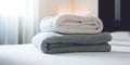 Clean, fresh towels adorn hotel room bed. Royalty Free Stock Photo