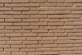 Clean, freshly painted, tan, generic, brick cinder block wall background