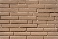 Clean, freshly painted, tan, generic, brick cinder block wall background Royalty Free Stock Photo