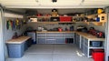 A clean garage with a workbench and labeled bins for tools and Royalty Free Stock Photo