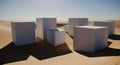 Abstract geometric blocks in desert landscape bathed in sunlight creating a minimalist composition Royalty Free Stock Photo