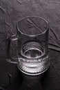 Clean glass mug with transparent liquid. Royalty Free Stock Photo